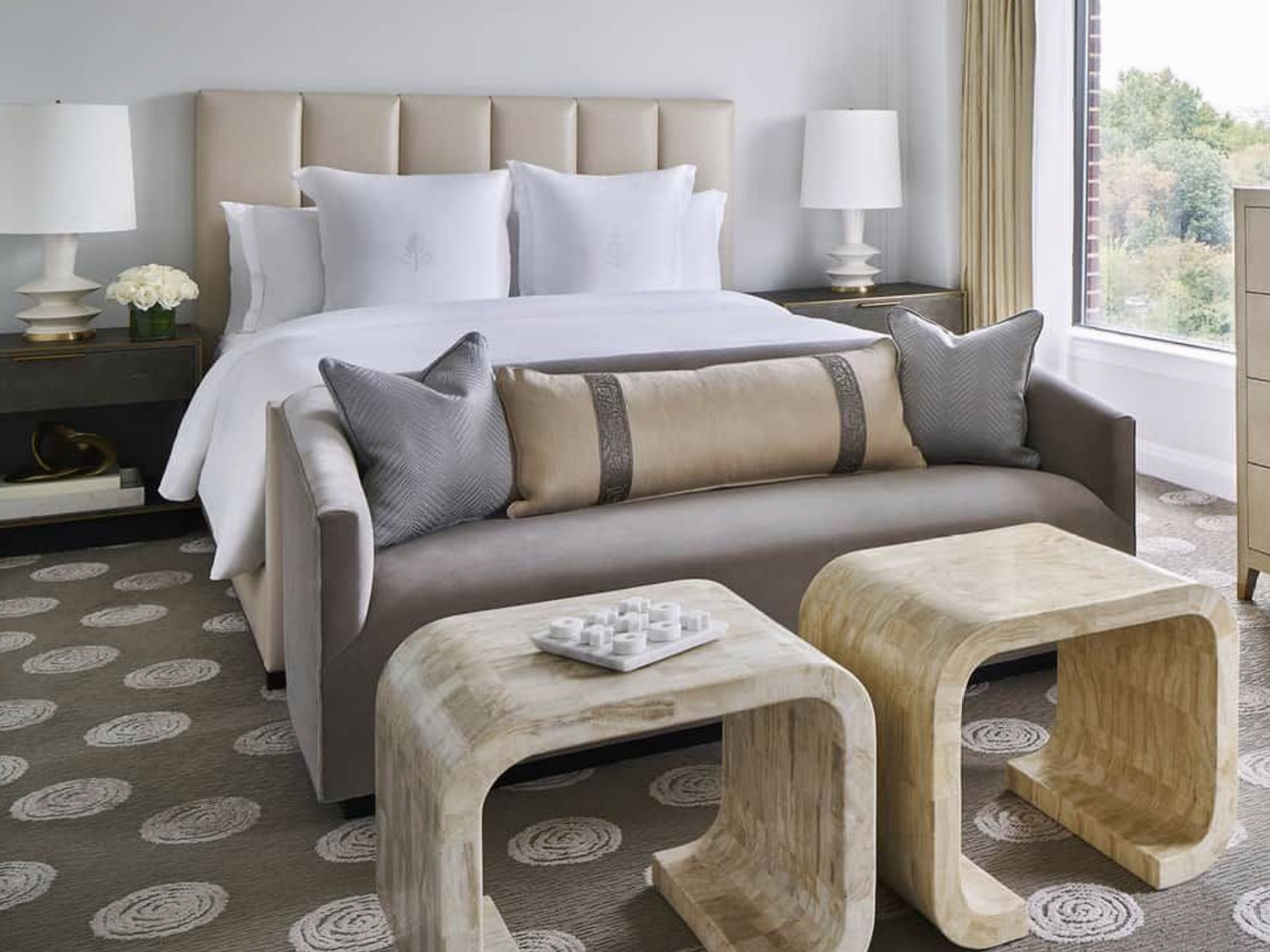 bright hotel guest room with bed 